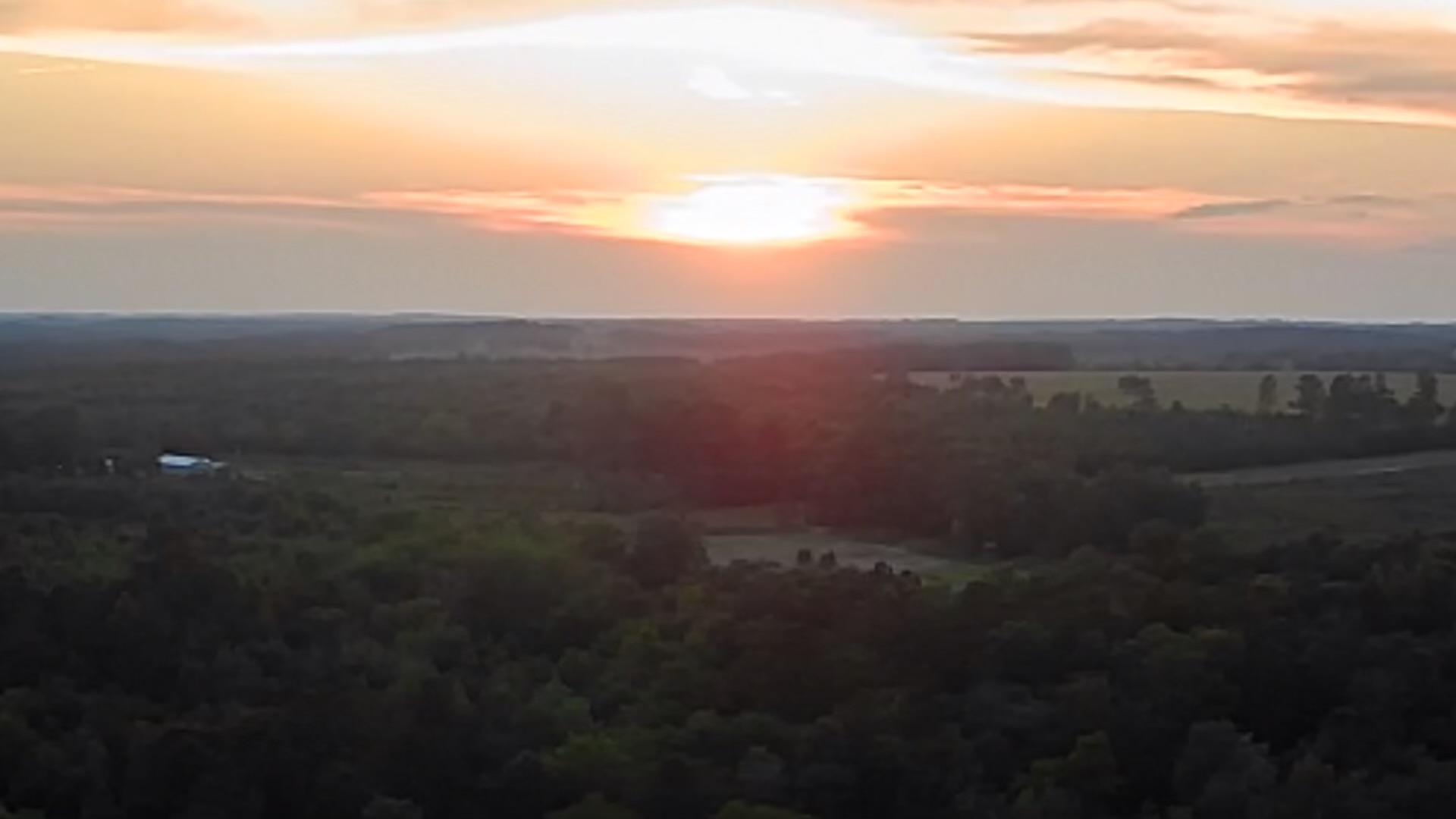 Sunset over the timber and fields of Trigger Bow Ranch in Taylor County, Georgia